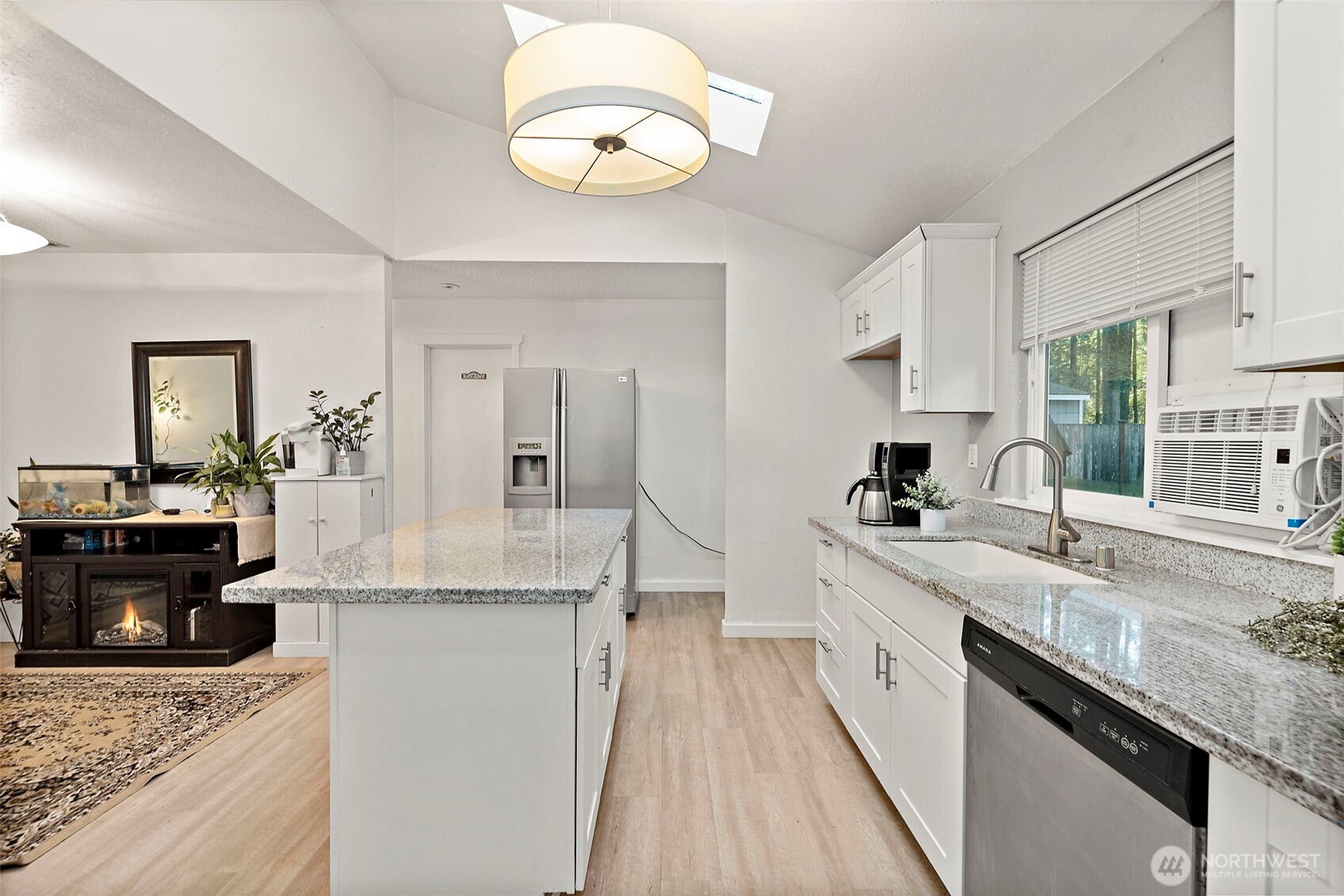 19401 Southeast 267th Street Covington, WA 98042 - Photo 9 of 31 a large kitchen with stainless steel appliances granite countertop a sink stove and refrigerator