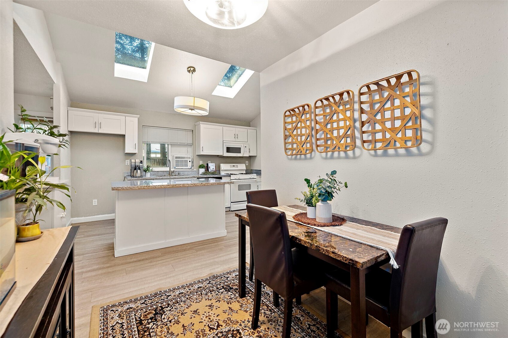 19401 Southeast 267th Street Covington, WA 98042 - Photo 10 of 31 a view of a dining room with furniture