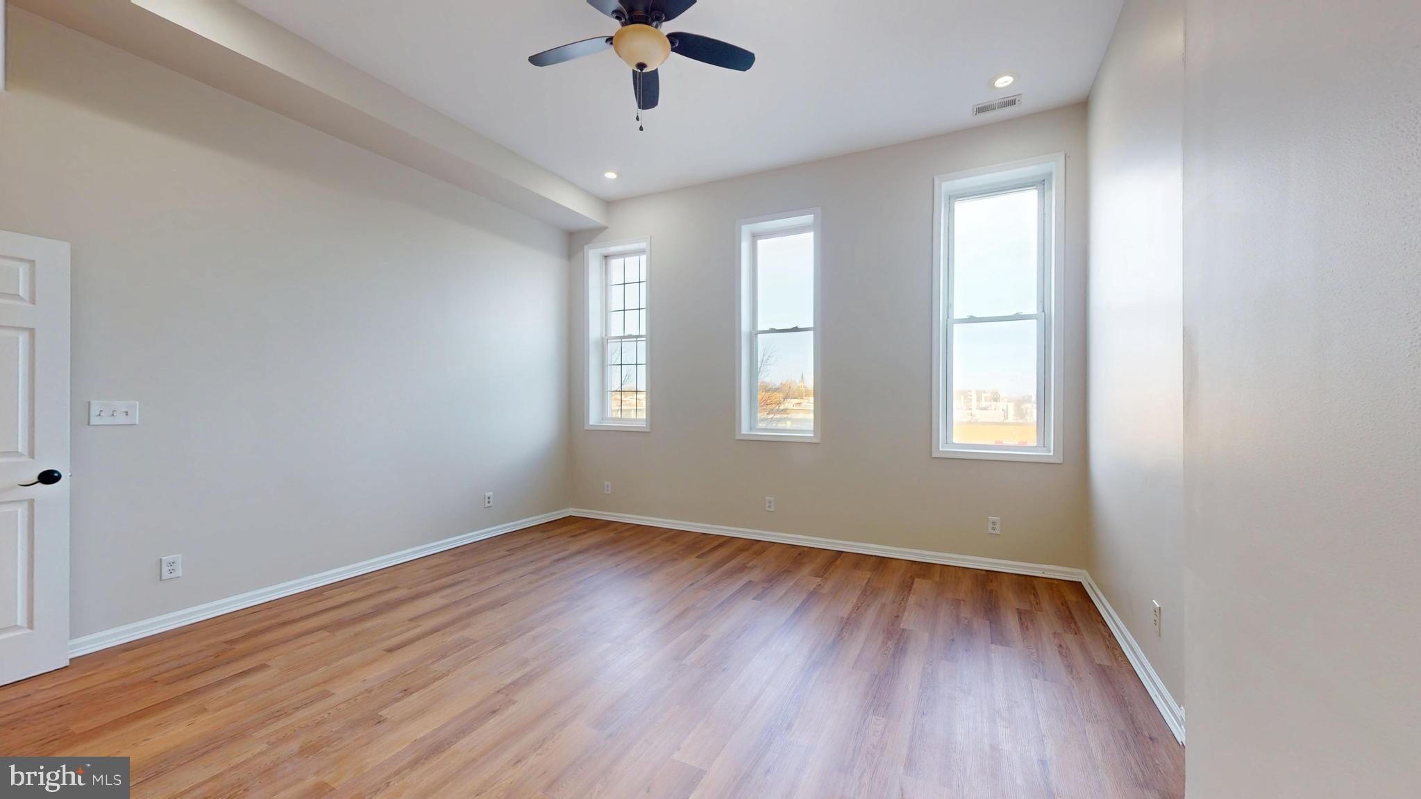 708 North Gilmor Street Baltimore, MD 21217 - Photo 15 of 35 wooden floor in an empty room with a window