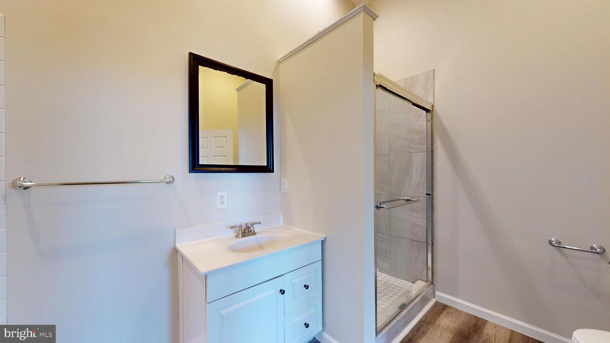 708 North Gilmor Street Baltimore, MD 21217 - Photo 18 of 35 a bathroom with a sink and mirror with toilet