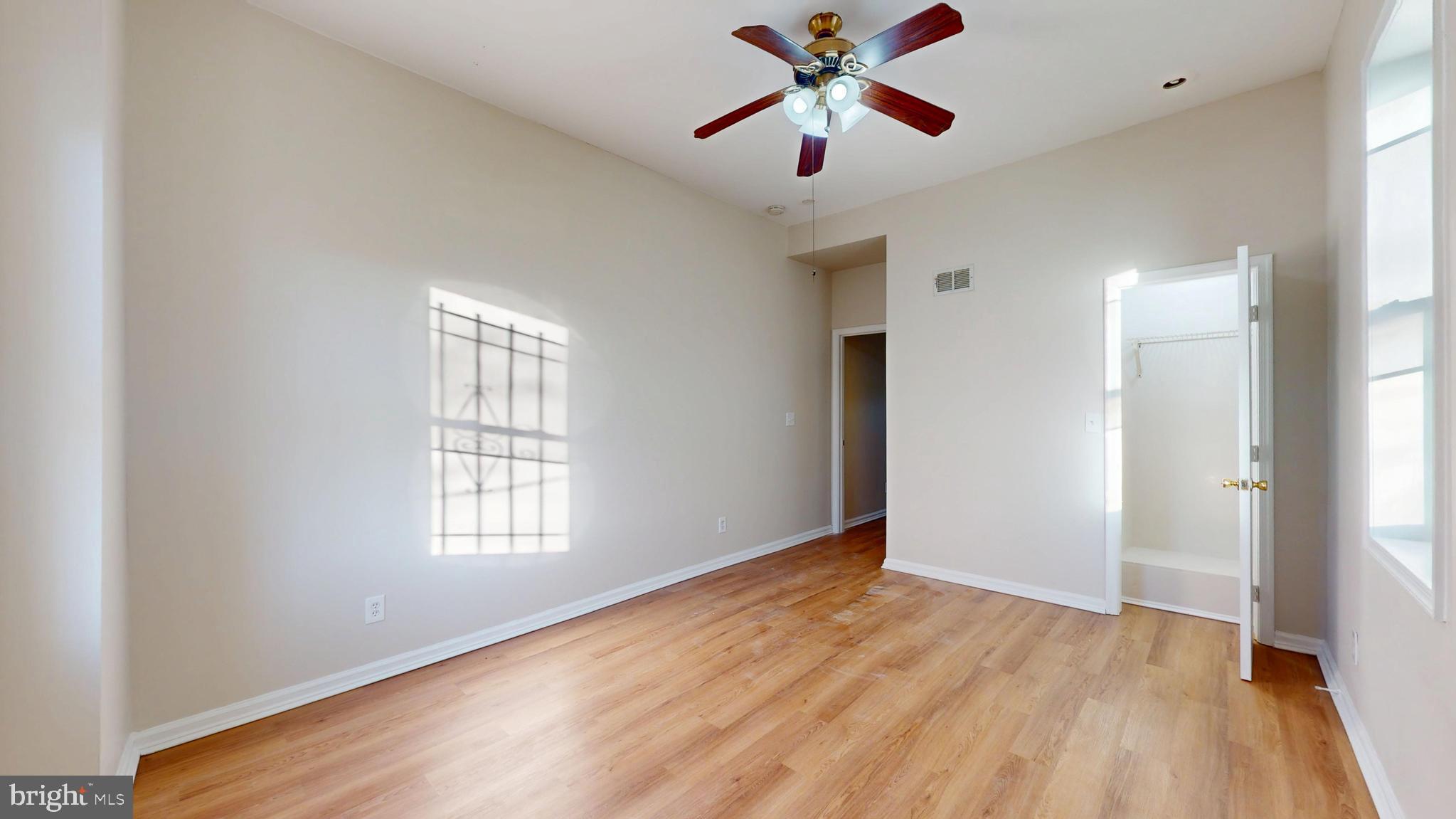 708 North Gilmor Street Baltimore, MD 21217 - Photo 23 of 35 wooden floor in an empty room with a window