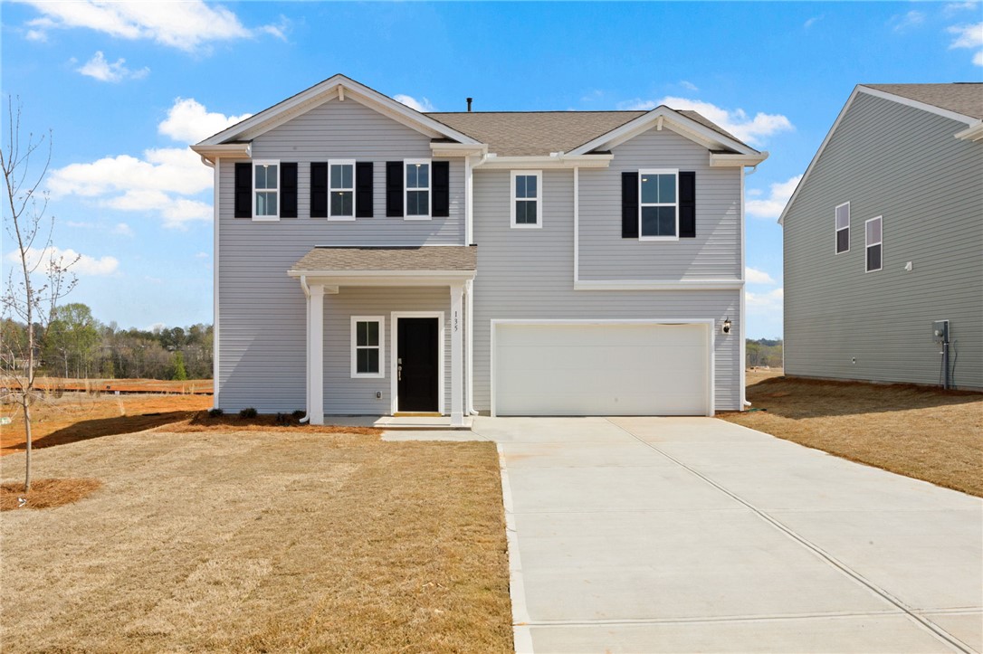 135 Cedar Shoals Easley, SC 29640 - Photo 1 of 37 This newly constructed residence presents a pristine exterior with modern curb appeal.
