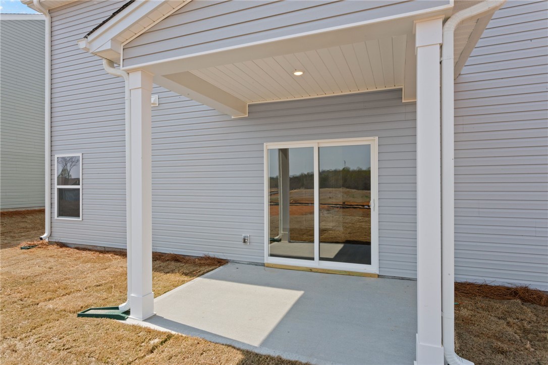 135 Cedar Shoals Easley, SC 29640 - Photo 31 of 37 This patio offers an inviting outdoor retreat, ideal for relaxing moments and serene gatherings.
