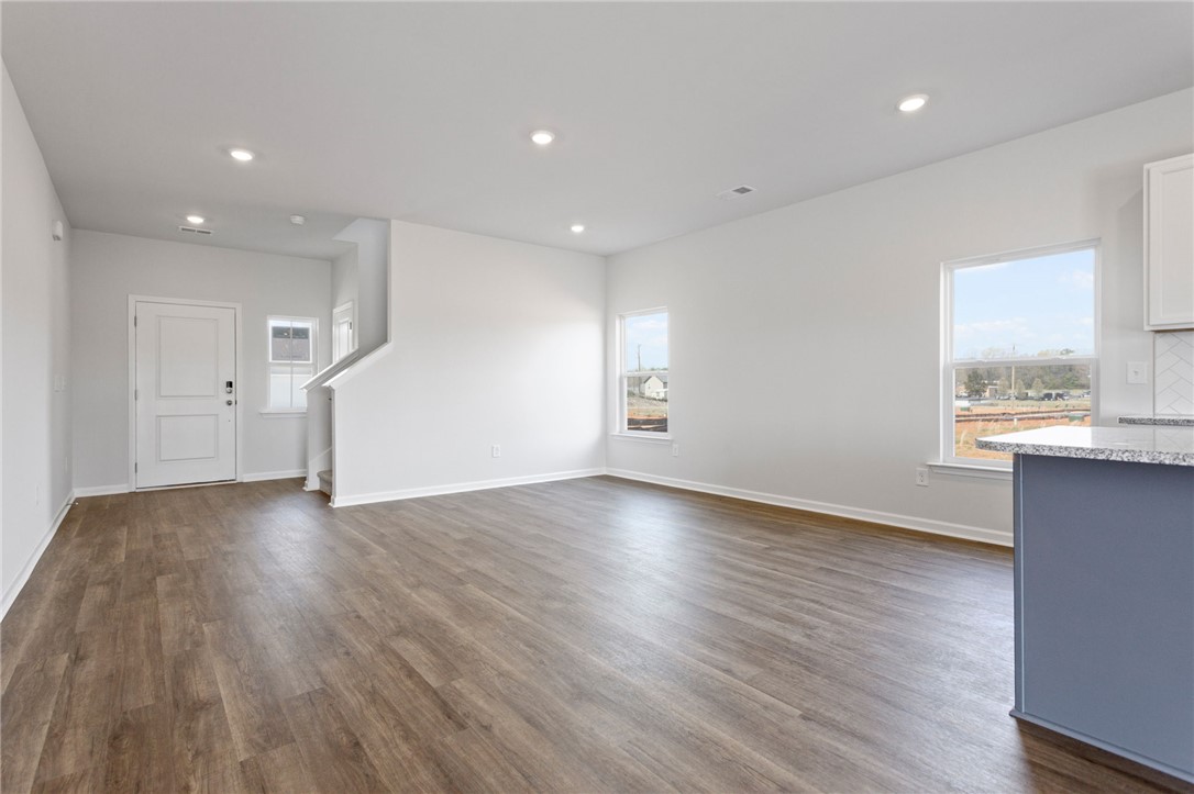 135 Cedar Shoals Easley, SC 29640 - Photo 7 of 37 This bright and airy interior boasts contemporary design elements and ample natural light.