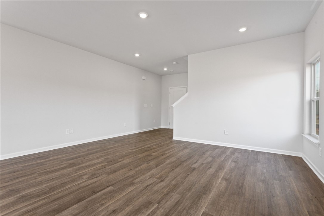 135 Cedar Shoals Easley, SC 29640 - Photo 8 of 37 This bright, airy room features rich wood flooring and abundant natural light, creating an inviting atmosphere.