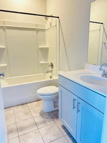 a bathroom with a sink a toilet and a bathtub