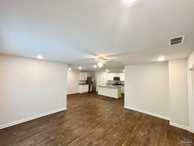 a view of a kitchen with a sink and a window