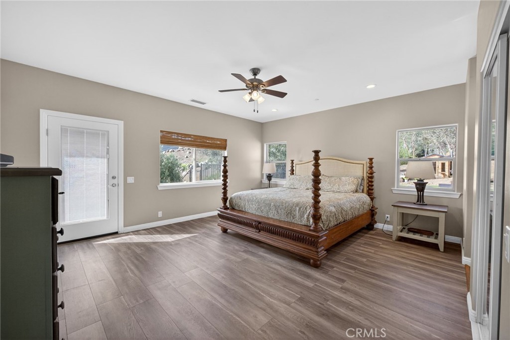 2914 Vista Del Rio Fallbrook, CA 92028 - Photo 40 of 57 a bedroom with a bed lamp closet and window