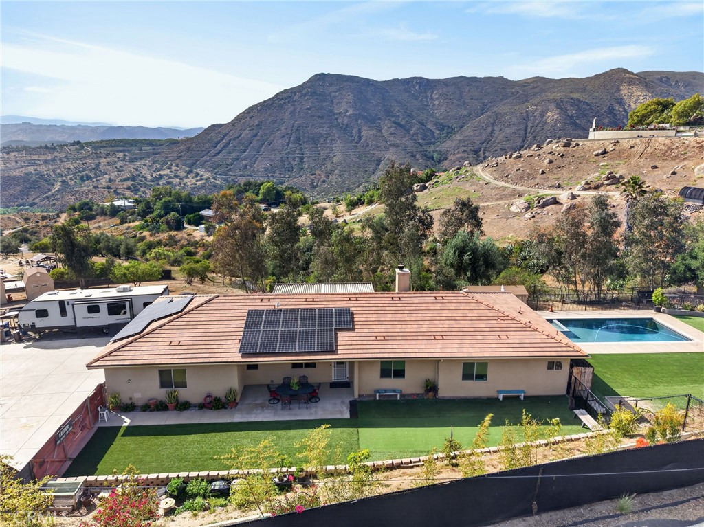 2914 Vista Del Rio Fallbrook, CA 92028 - Photo 4 of 57 an aerial view of a house in a big yard with swimming pool and green space