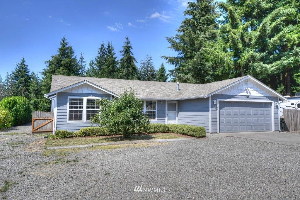5436 187th Court Southwest Rochester, WA 98579 - Photo 1 of 25 a front view of a house with garden