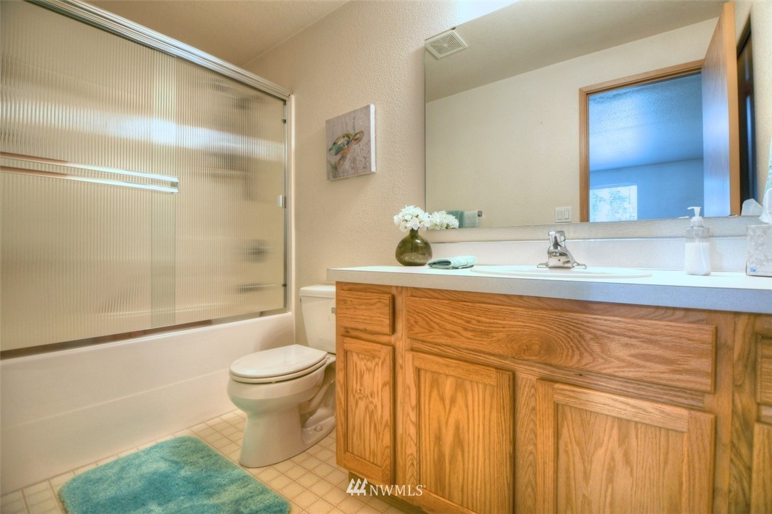 5436 187th Court Southwest Rochester, WA 98579 - Photo 14 of 25 a bathroom with a sink toilet and shower