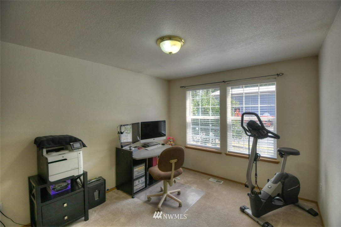 5436 187th Court Southwest Rochester, WA 98579 - Photo 16 of 25 a view of a workspace with furniture and a window