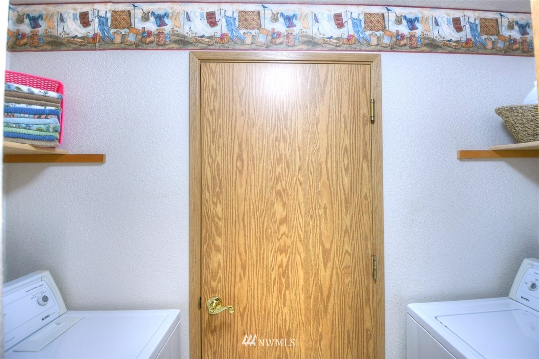5436 187th Court Southwest Rochester, WA 98579 - Photo 18 of 25 a bathroom with a sink a toilet and a shower curtain