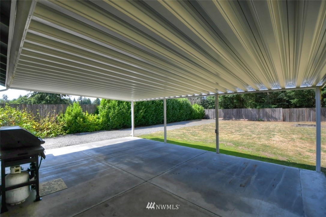 5436 187th Court Southwest Rochester, WA 98579 - Photo 19 of 25 a view of a backyard with swimming pool