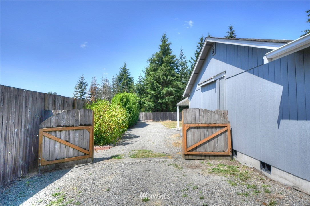 5436 187th Court Southwest Rochester, WA 98579 - Photo 20 of 25 a view of backyard of house