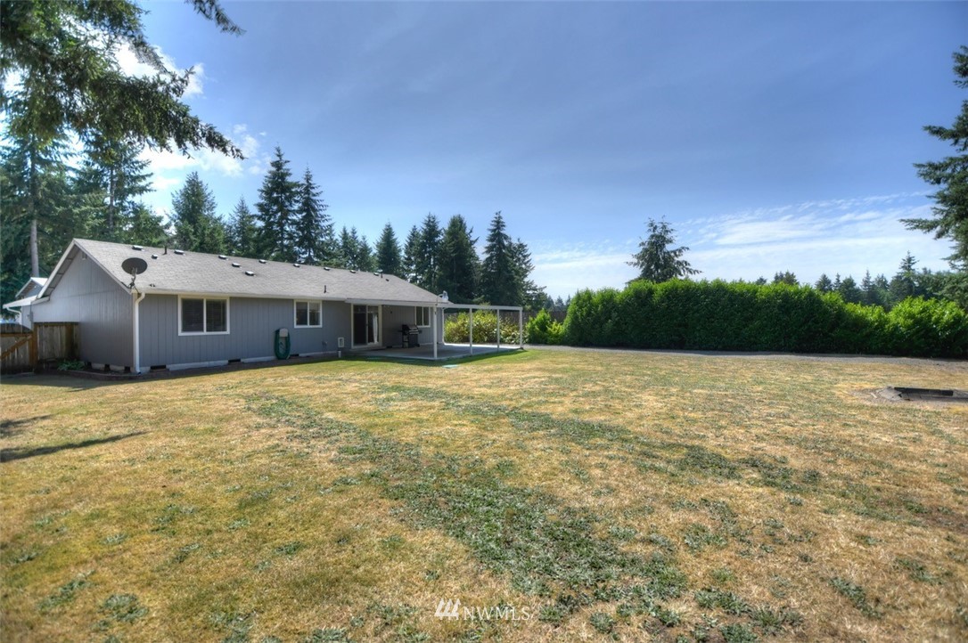 5436 187th Court Southwest Rochester, WA 98579 - Photo 22 of 25 a house view with a garden space