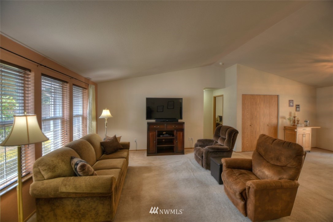 5436 187th Court Southwest Rochester, WA 98579 - Photo 4 of 25 a living room with furniture and a flat screen tv
