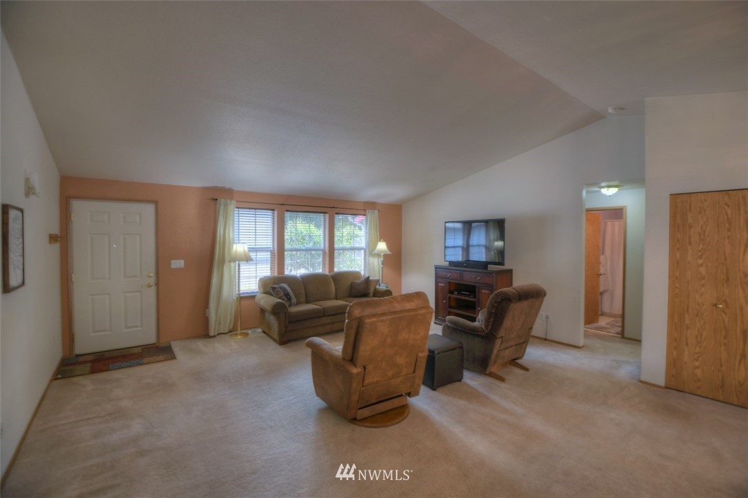 5436 187th Court Southwest Rochester, WA 98579 - Photo 6 of 25 a living room with furniture and a window