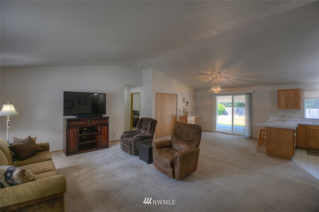 5436 187th Court Southwest Rochester, WA 98579 - Photo 7 of 25 a living room with furniture and a flat screen tv