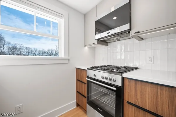 a kitchen with a stove and a microwave