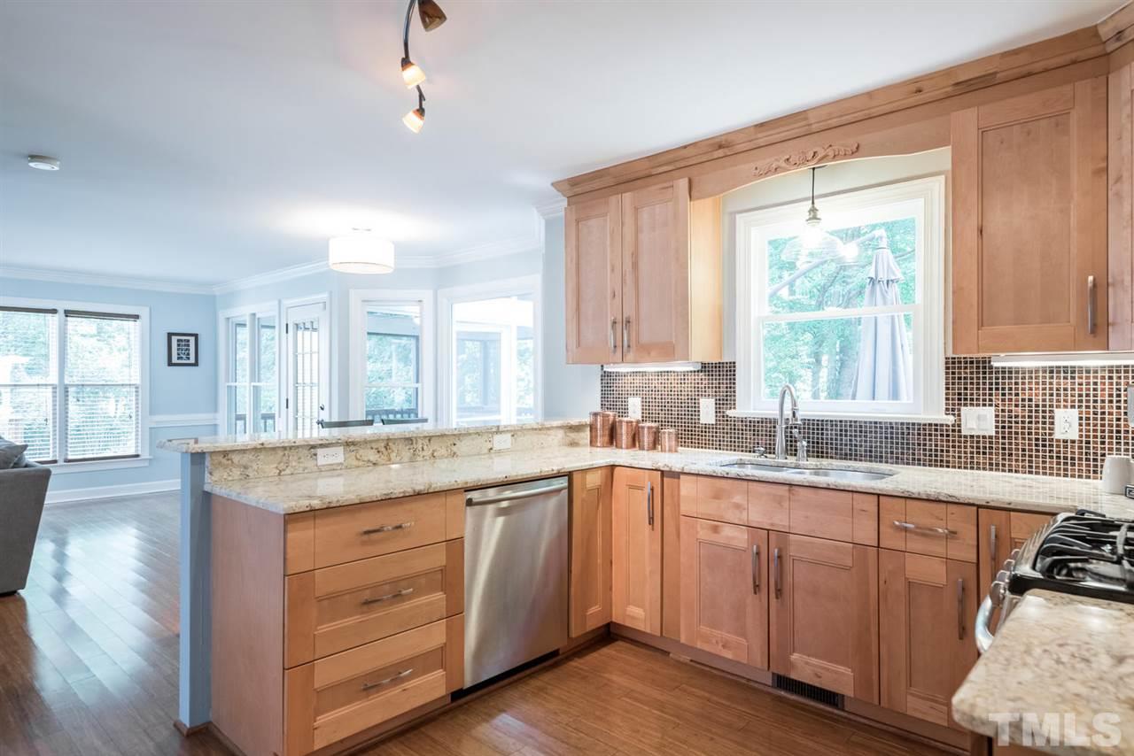 2612 Dahlgreen Road Raleigh, NC 27615 - Photo 12 of 25 a kitchen with a sink stove and cabinets