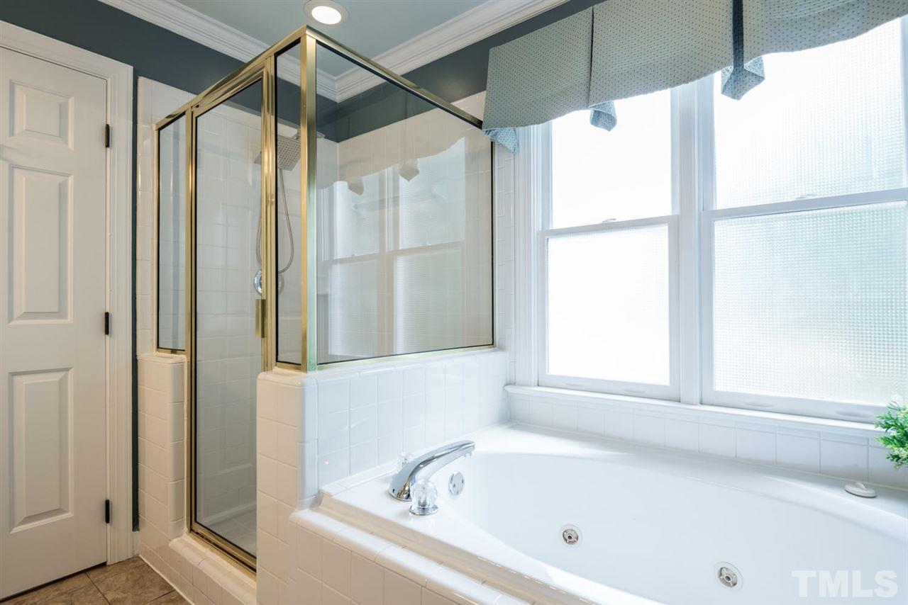 2612 Dahlgreen Road Raleigh, NC 27615 - Photo 16 of 25 a bathroom with a bathtub and a shower