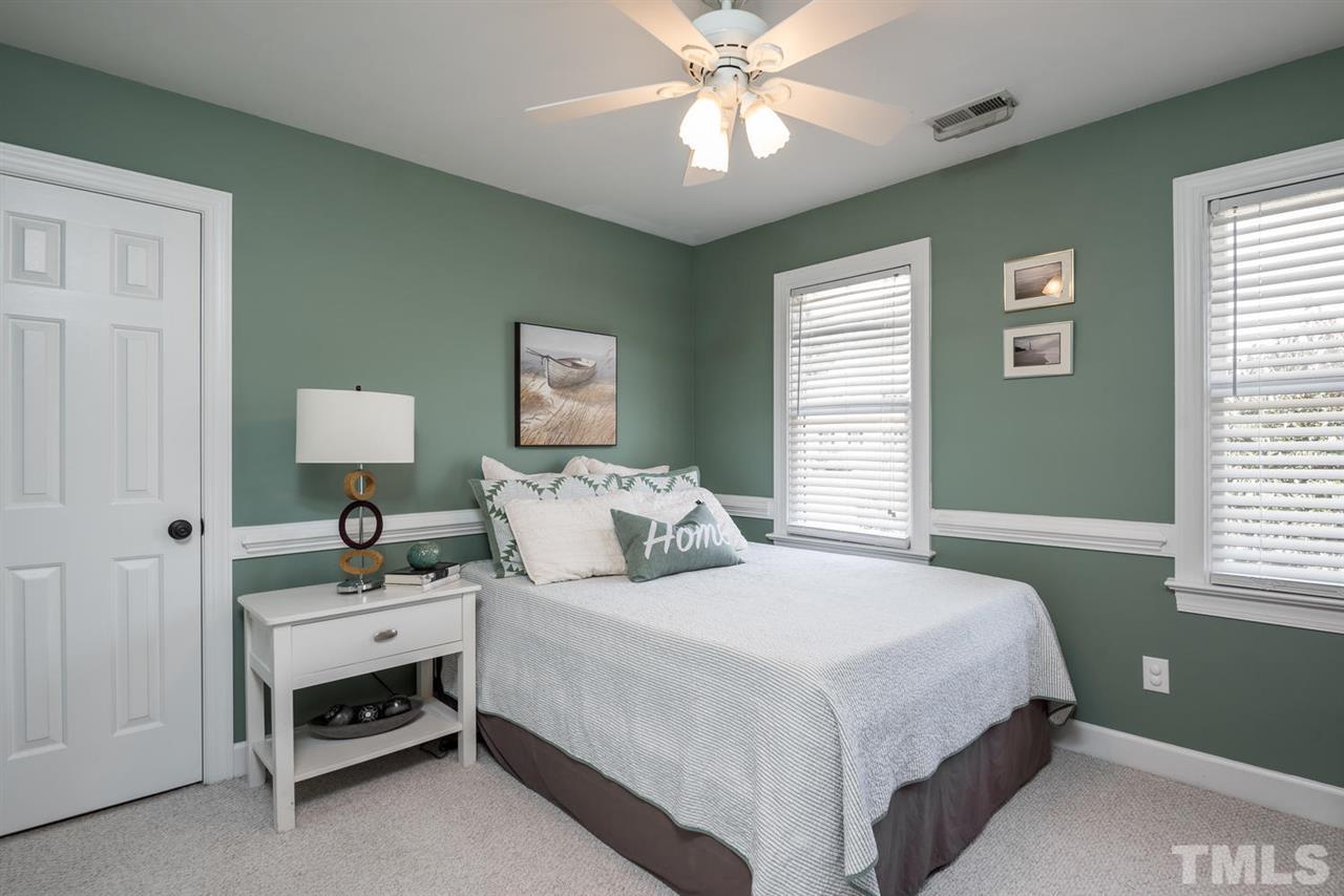 2612 Dahlgreen Road Raleigh, NC 27615 - Photo 17 of 25 a bedroom with a bed and a window