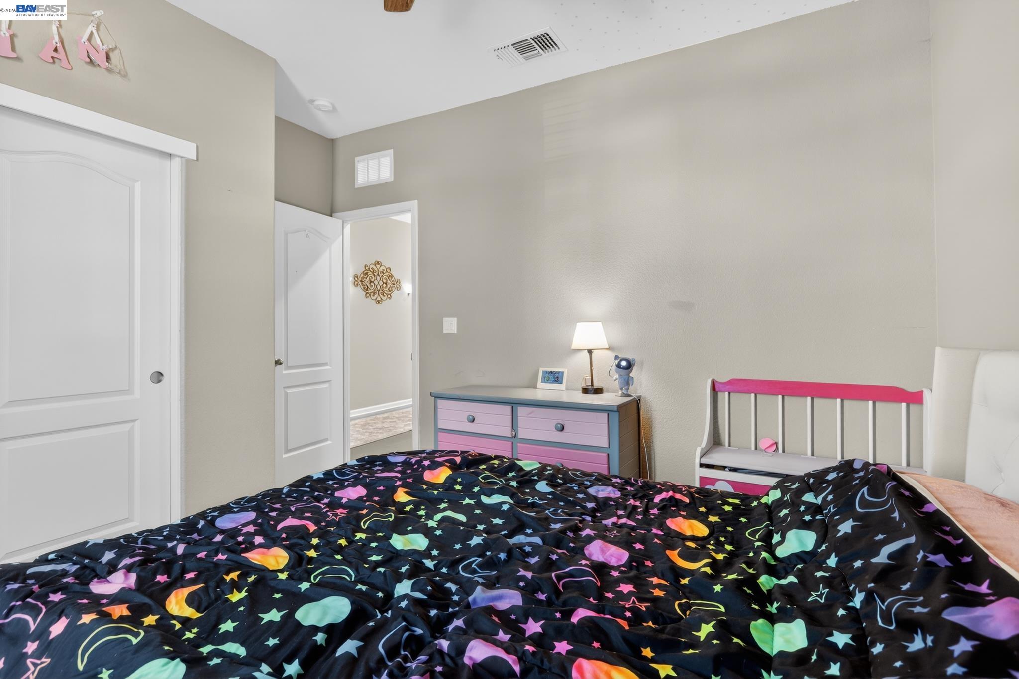1974 Garden Lane Rio Vista, CA 94571 - Photo 10 of 19 a bedroom with bed and a chandelier
