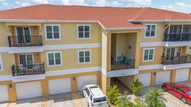 a front view of a house with many windows