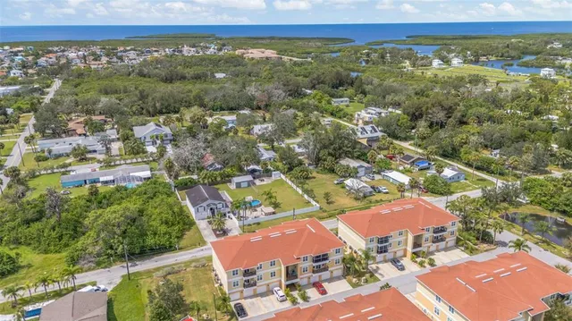 an aerial view of residential houses and outdoor space