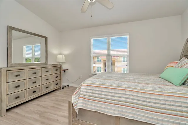 a bedroom with a bed and a dresser