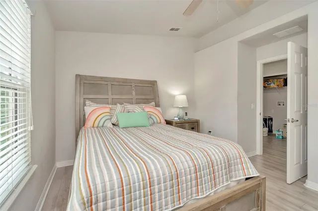 a bedroom with a bed and window