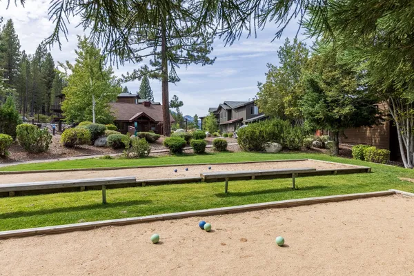 a kitchen with stainless steel appliances granite countertop a refrigerator a stove and a sink with granite countertops