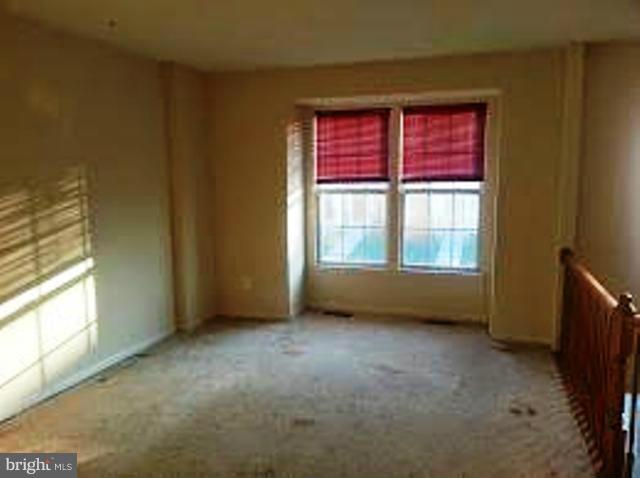 1008 Hickam Road Middle River, MD 21220 - Photo 3 of 6 a view of an empty room with window