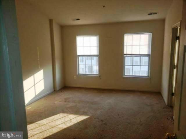 1008 Hickam Road Middle River, MD 21220 - Photo 5 of 6 an empty room with windows