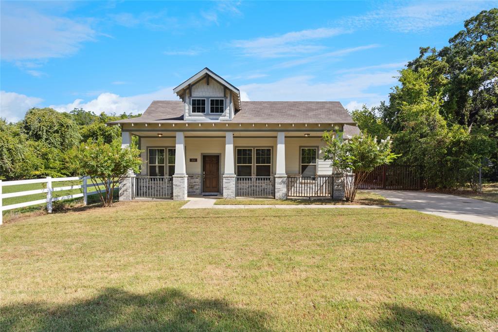 404 West 3rd Street Kennedale, TX 76060 - Photo 1 of 1 a front view of a house with a yard