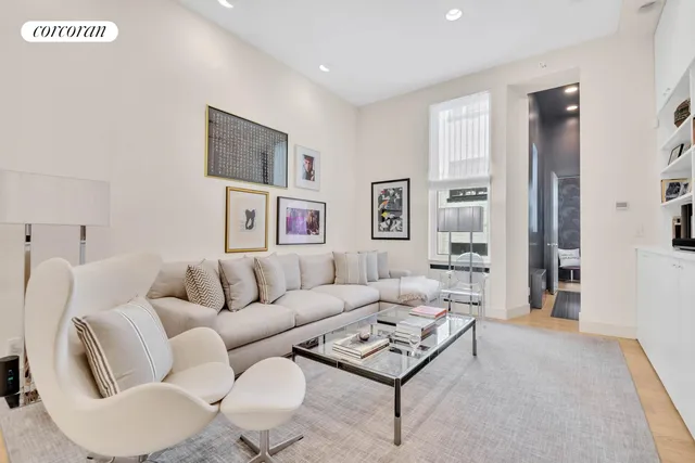 a living room with furniture and a table