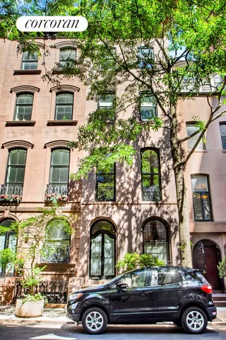 a front view of a house with parking