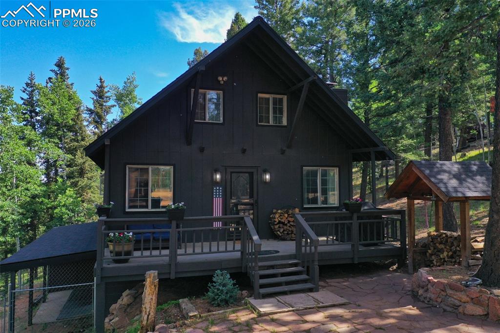 377 Ridge Road Divide, CO 80814 - Photo 46 of 50 a front view of a house with a garden