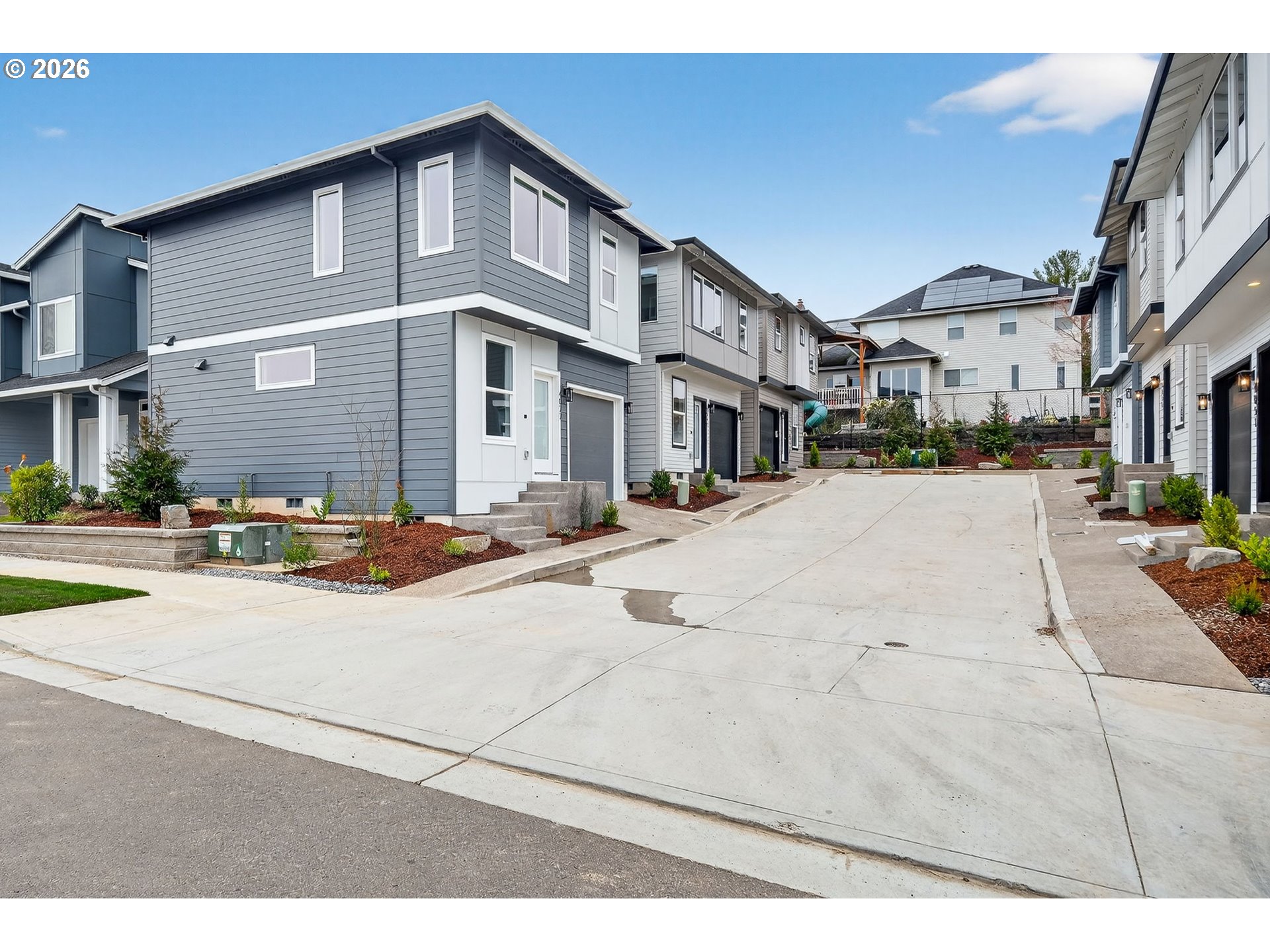 4059 Southwest McKinley Street, Unit 40 Gresham, OR 97080 - Photo 32 of 39 a street view along with residential houses