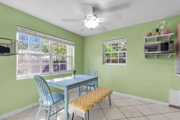 a view of a dining room with furniture and a window