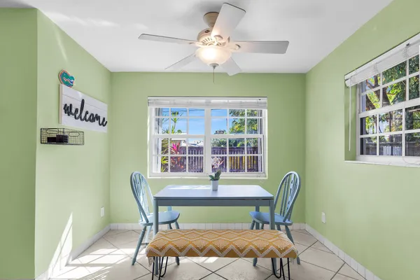a dining room with furniture and window