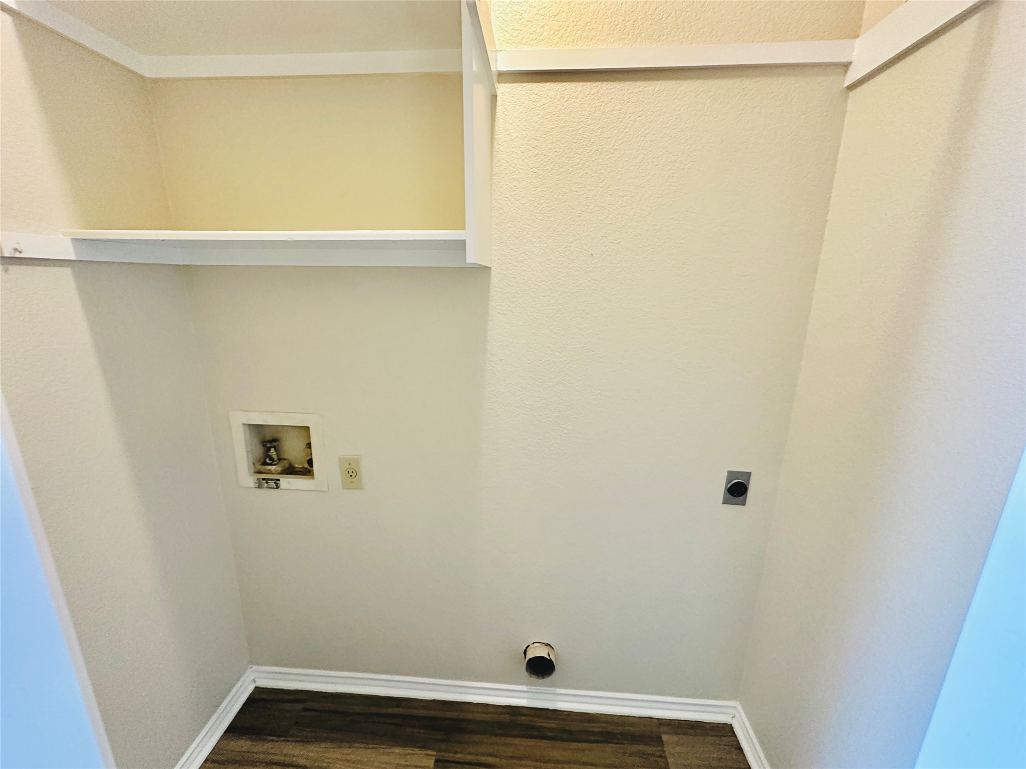 8814 Schick Road, Unit C Austin, TX 78729 - Photo 22 of 35 A dedicated laundry space with convenient hookups and overhead shelving.