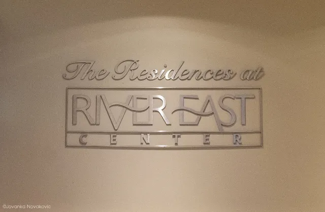 a living room with furniture and a mirror