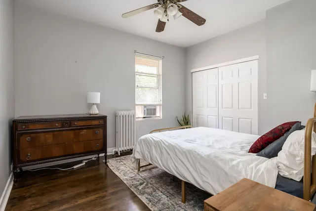 a bedroom with a bed and a television