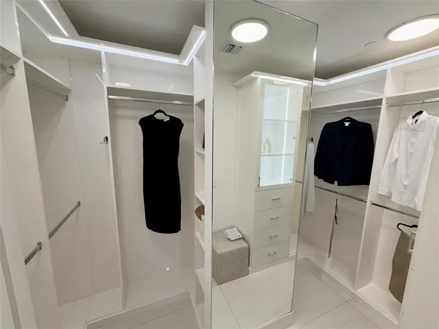 a bathroom with a shower and a tub