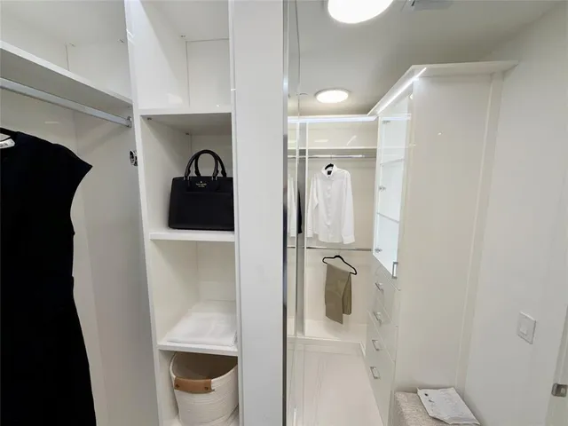 a bathroom with a shower and mirror