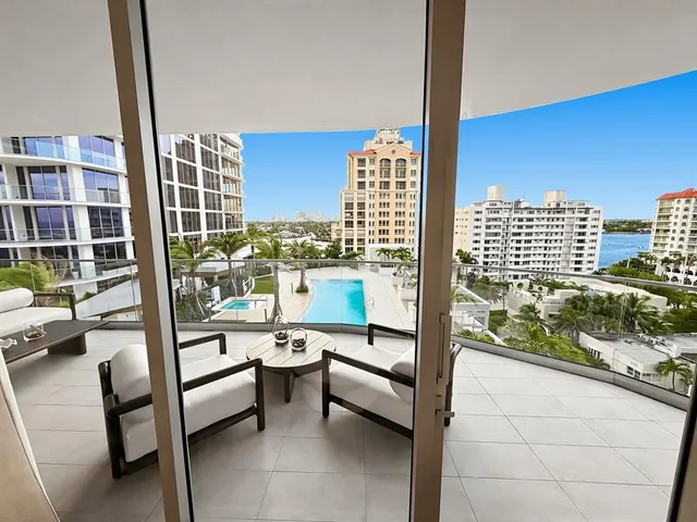 a view of a balcony with chairs