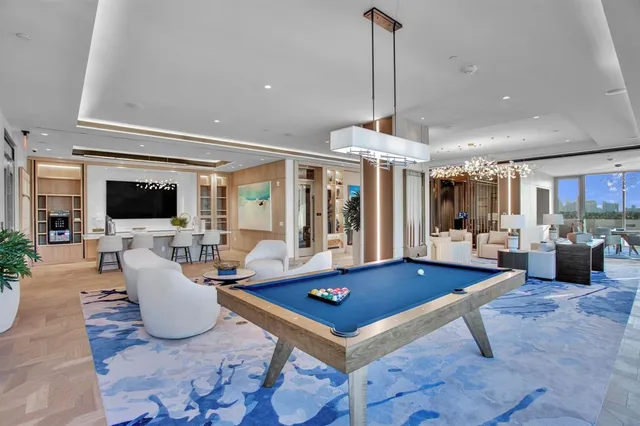 a living room with fireplace furniture and a flat screen tv