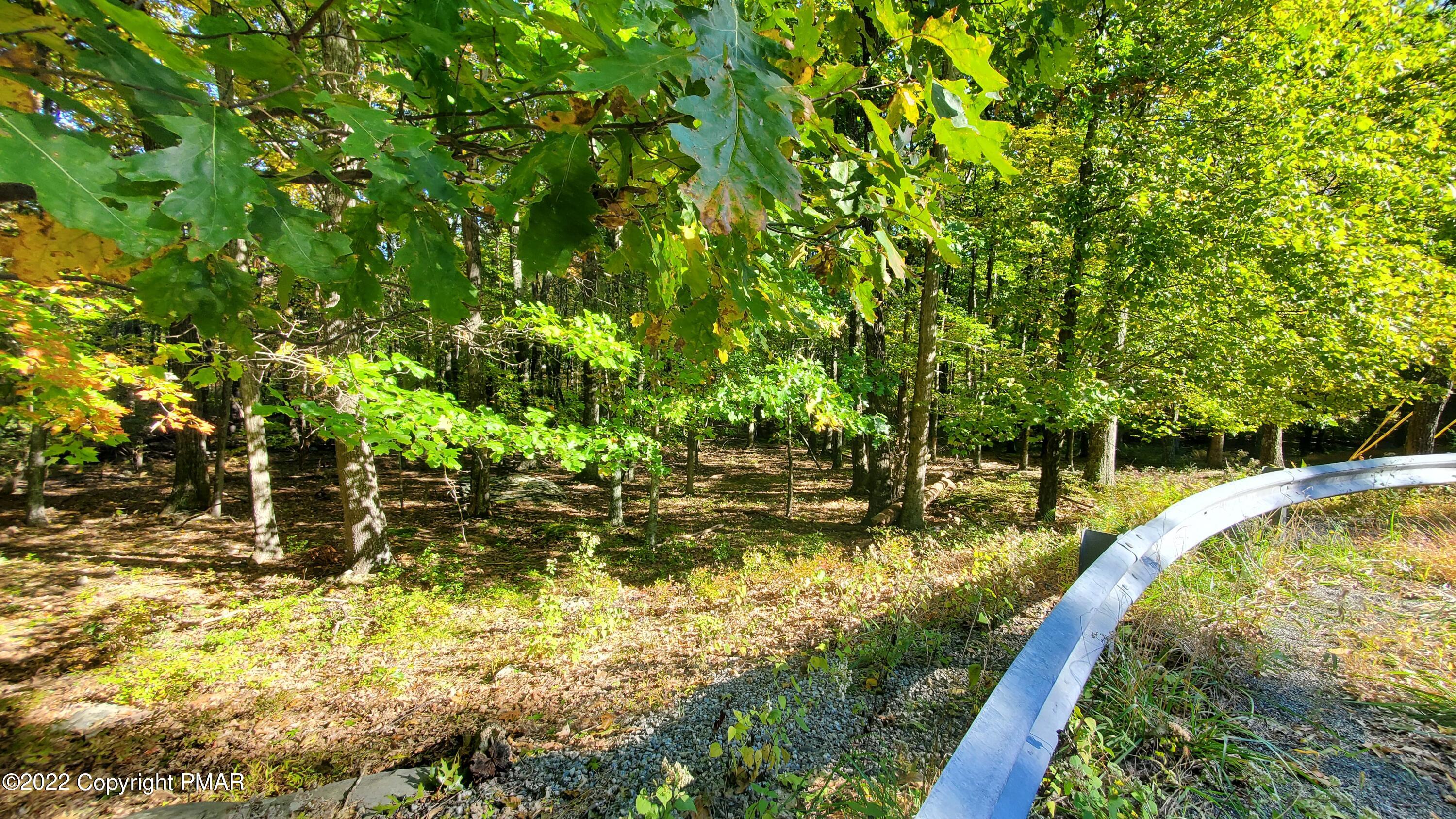 Lot 3582 Warrick Court Bushkill, PA 18324 - Photo 4 of 8 a view of a lake with houses